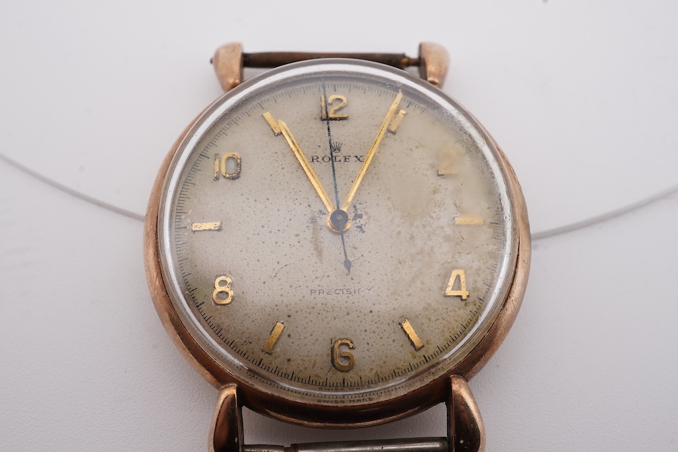 A gentleman's 1940's? 9ct gold Rolex manual wind wrist watch, with signed Super Balance movement, the inner case back numbered 4411 over 844, case diameter 34mm, no strap or winding crown. Condition - poor